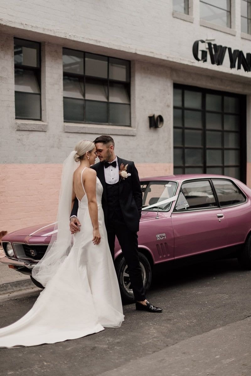 Melbourne Bride And Groom Pose Near Glasshaus Wedding Venue