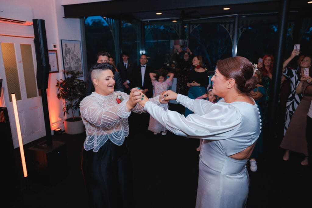 Lesbian Couple Do First Dance at their Wedding at Studley Park Boathouse Photographed by Dreamlife